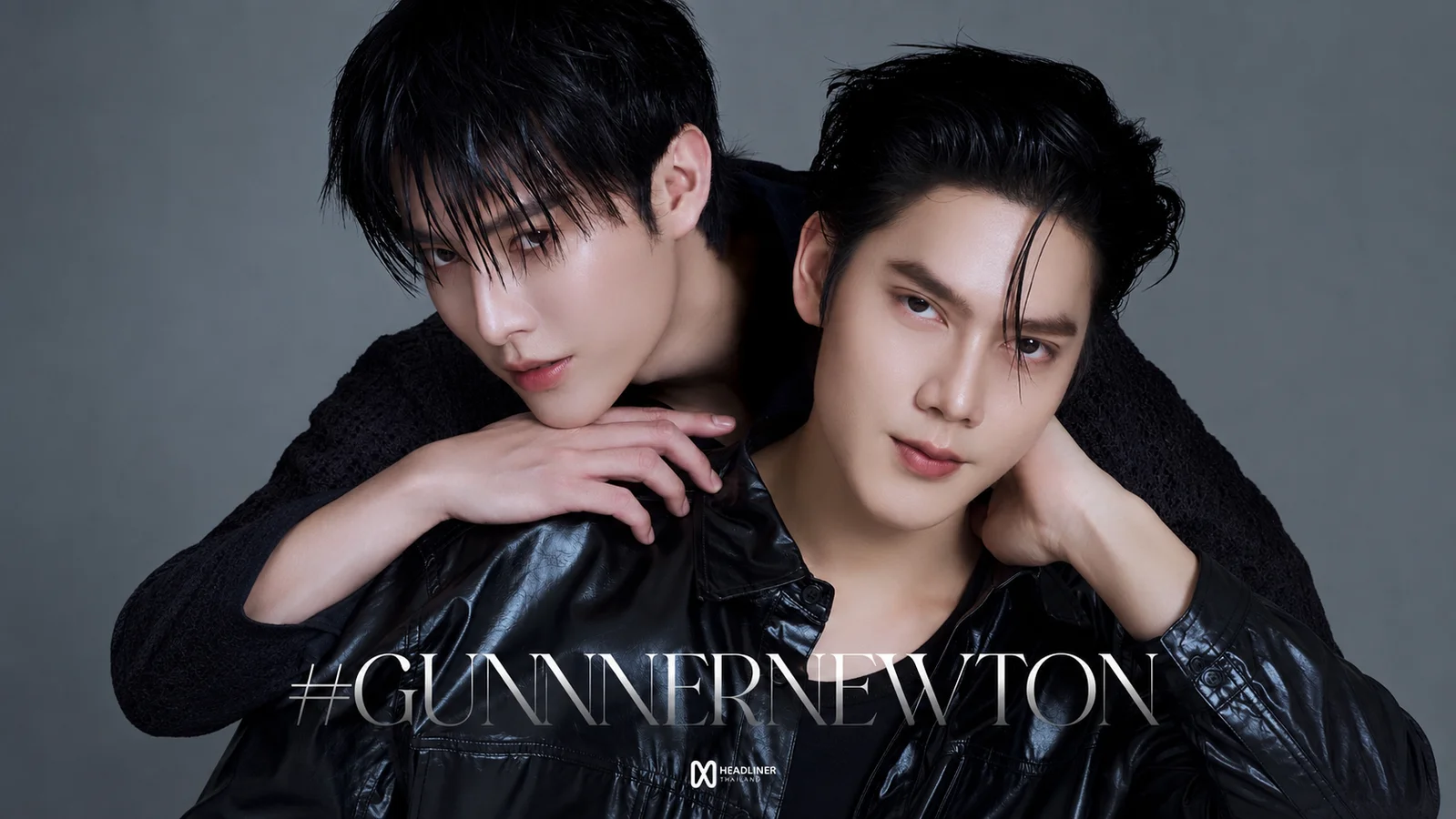 Gunner Natsakan and Newton Waiyakorn pose closely together in black outfits for Headliner Thailand’s official GunnerNewton announcement.