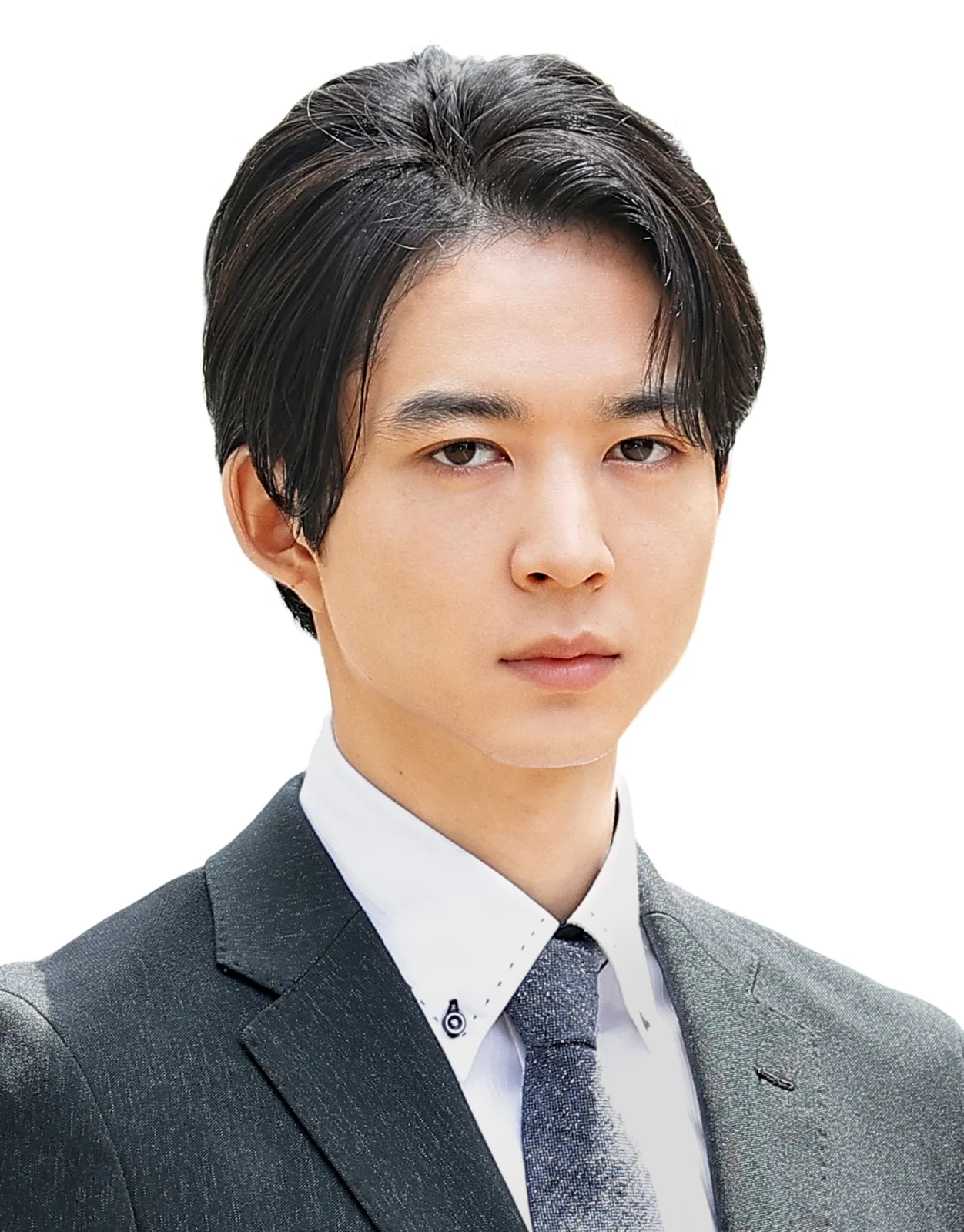 Professional headshot of Japanese actor Jin Suzuki wearing a gray suit and tie against a white background.