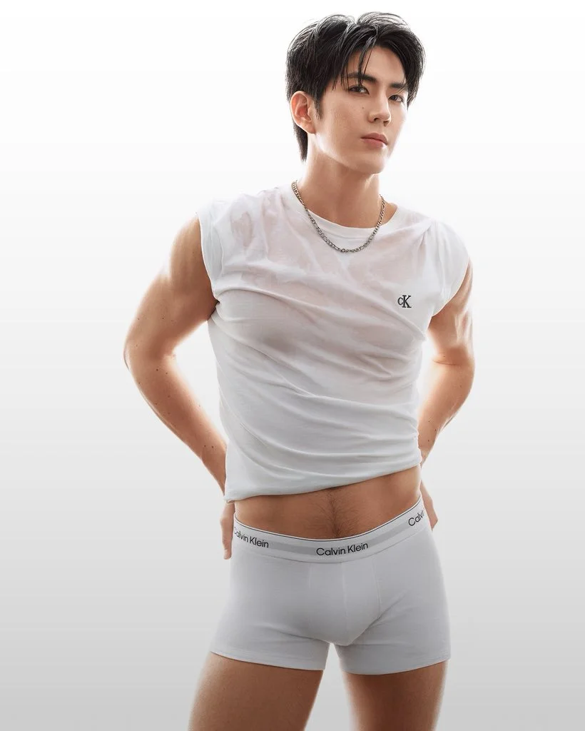 Sea Tawinan wears a sleeveless white Calvin Klein shirt with matching white boxer briefs.